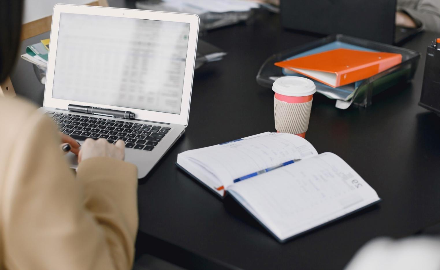 Team reviewing activity-based budget analysis on digital dashboard